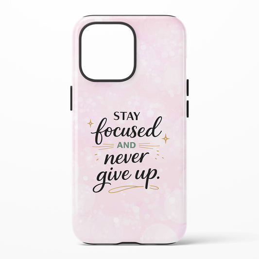 Phone case with 'Stay focused and never give up' text on a light pink background