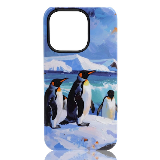 Phone case featuring illustrated penguins standing on ice with mountains and ocean in the background